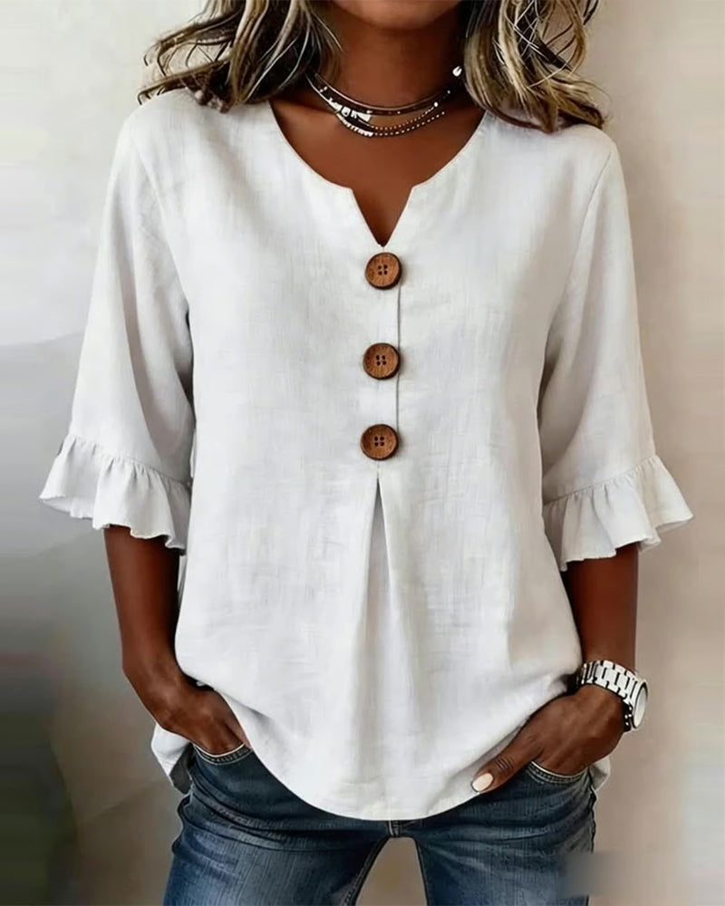 ROSARIO | Blusa lisa de algodón y lino con botones de madera y volantes