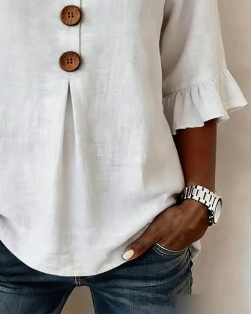 ROSARIO | Blusa lisa de algodón y lino con botones de madera y volantes
