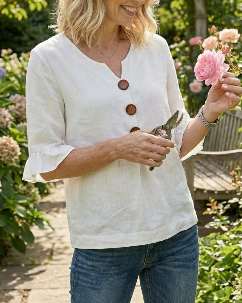 ROSARIO | Blusa lisa de algodón y lino con botones de madera y volantes