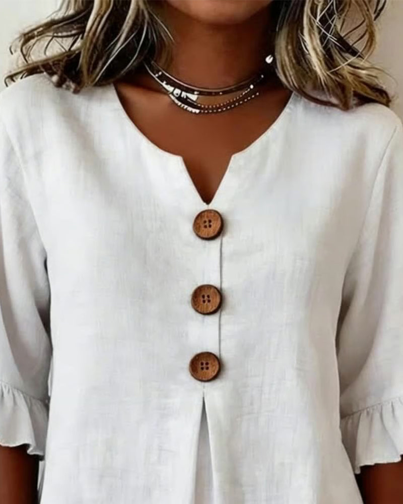 ROSARIO | Blusa lisa de algodón y lino con botones de madera y volantes