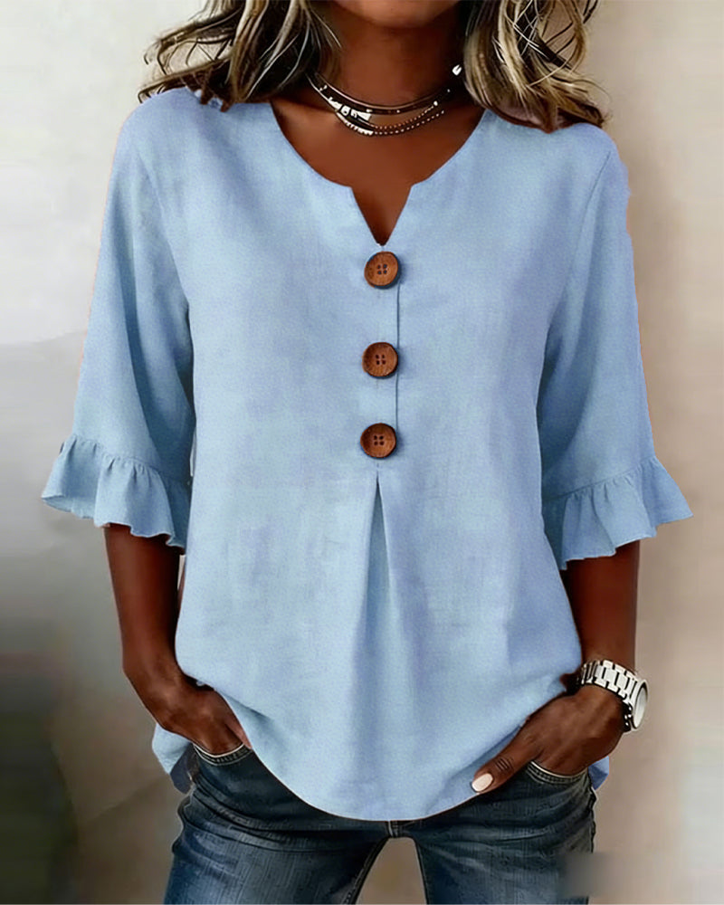 ROSARIO | Blusa lisa de algodón y lino con botones de madera y volantes