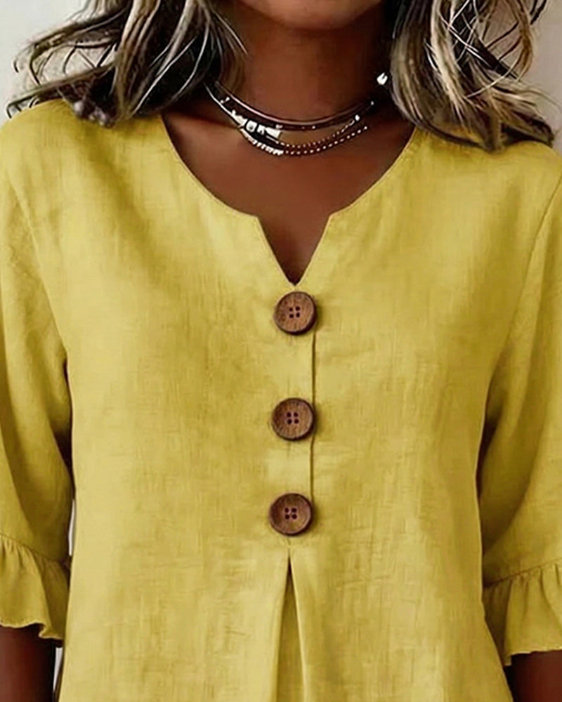 ROSARIO | Blusa lisa de algodón y lino con botones de madera y volantes