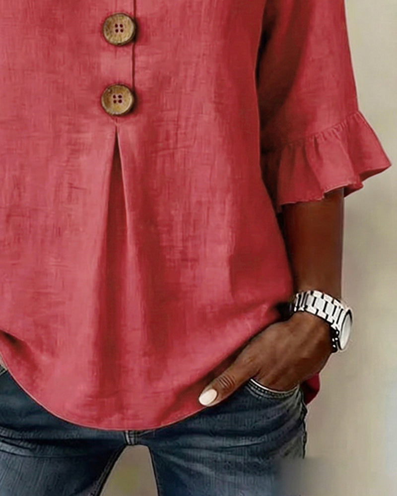 ROSARIO | Blusa lisa de algodón y lino con botones de madera y volantes