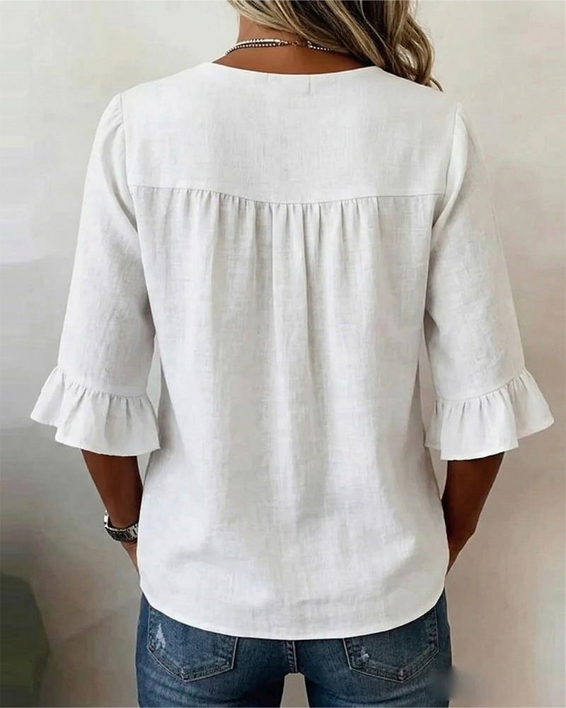 ROSARIO | Blusa lisa de algodón y lino con botones de madera y volantes