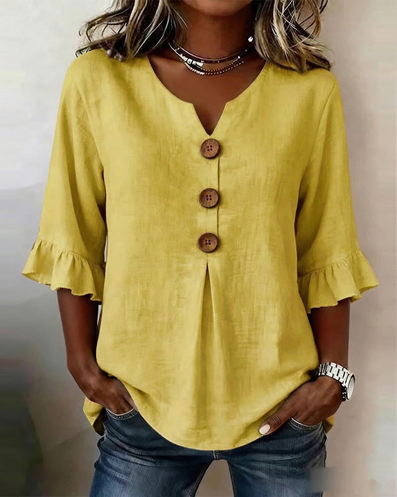 ROSARIO | Blusa lisa de algodón y lino con botones de madera y volantes