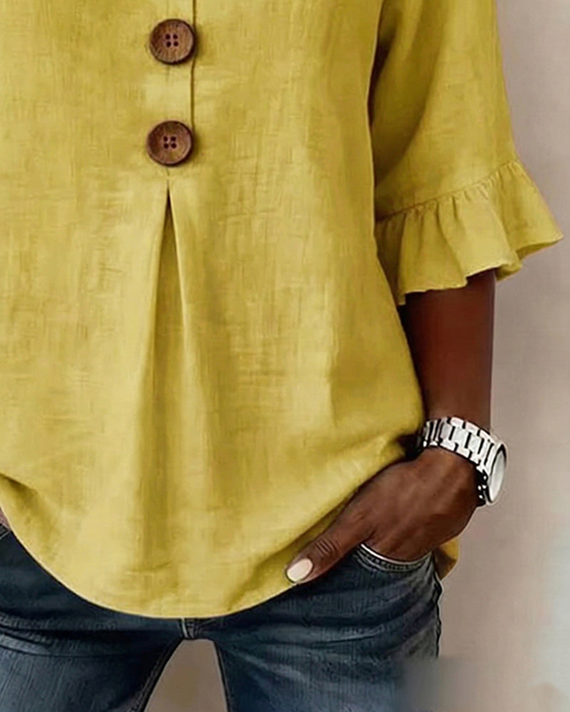 ROSARIO | Blusa lisa de algodón y lino con botones de madera y volantes